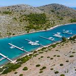 ACI Marina Piškera surrounded by Kornati islands with boats and clear Adriatic sea