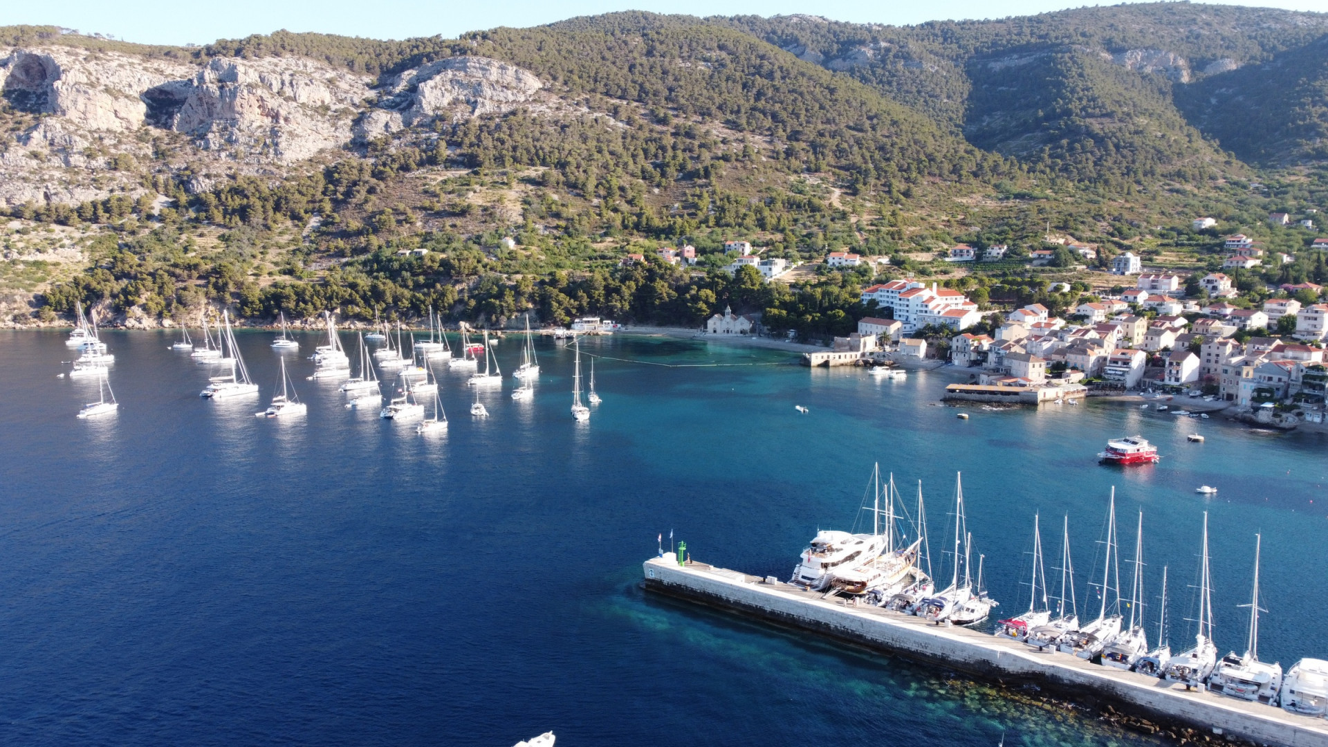 Komiža waterfront with small boats along the quay