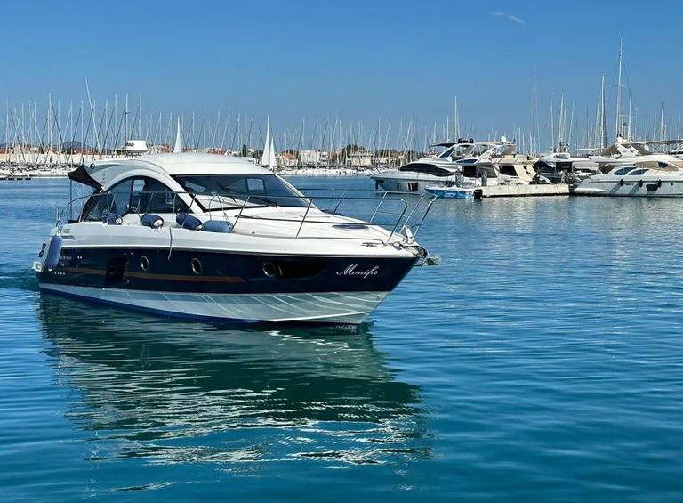 Monifa glides gracefully through tranquil waters, showcasing its sleek profile and elegant design.