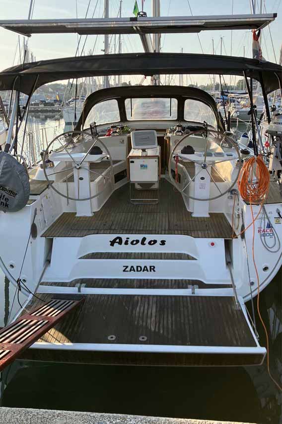 Spacious cockpit of Aiolos featuring elegant wood accents and modern navigation equipment.