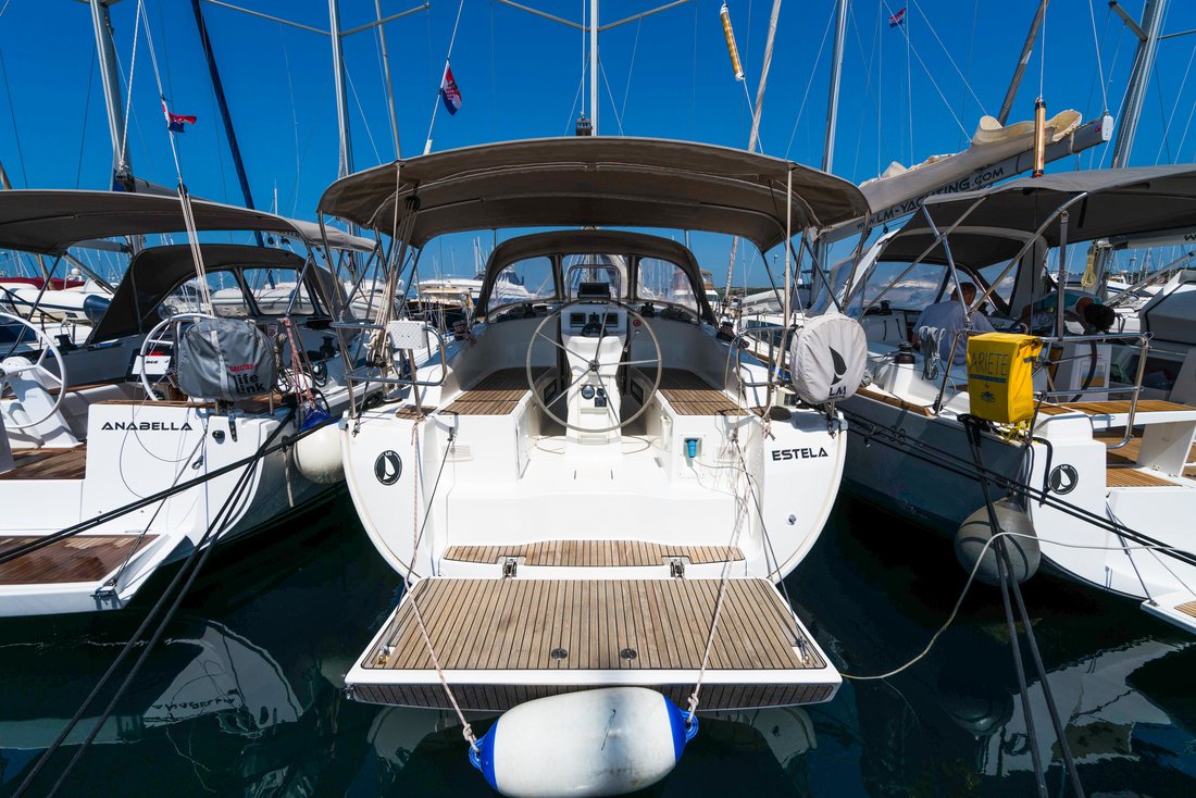 Sleek stern view of Estela, showcasing elegant lines and inviting teak deck.