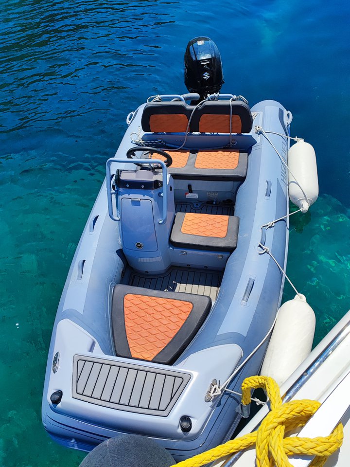 Oceana's sleek tender with stylish seating and a modern helm, ready for adventure.