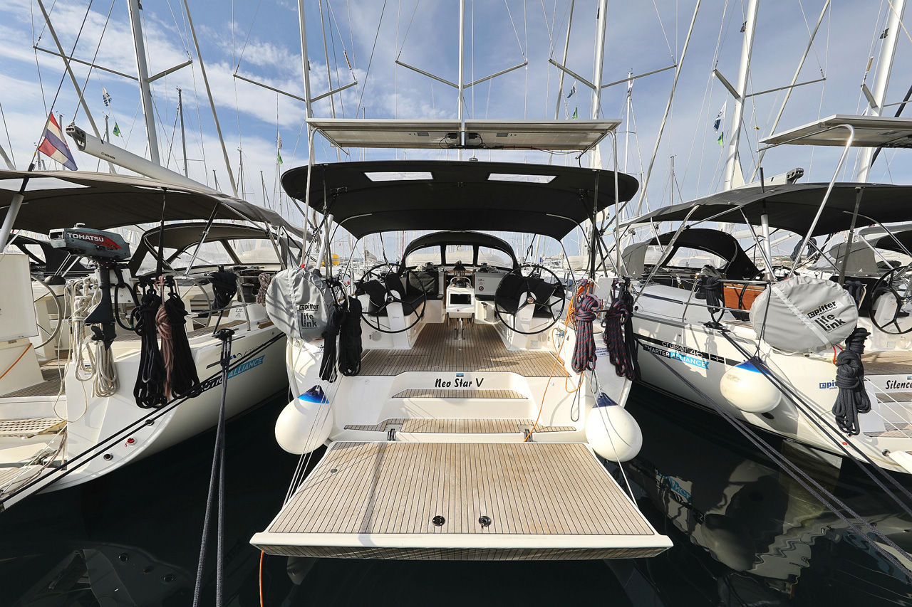Neo Star V docked in a marina, showcasing its sleek profile and elegant design.