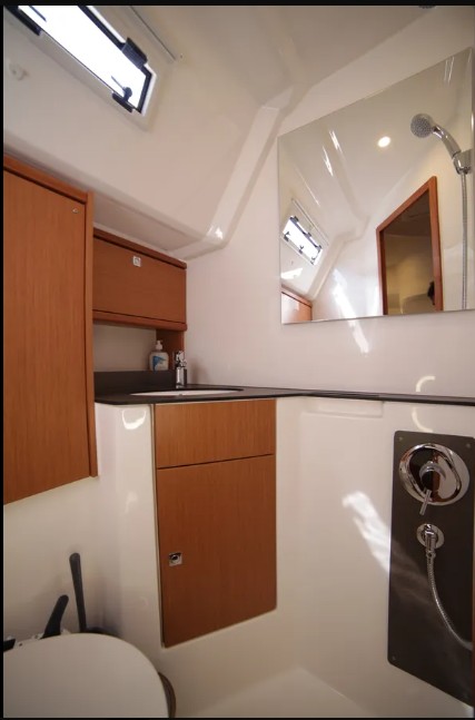 Sail Deneb's elegant bathroom features sleek cabinetry, modern fixtures, and natural lighting.