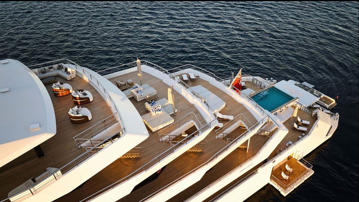 Expansive decks of Custom Renaissance featuring luxurious lounging areas and a stunning pool.