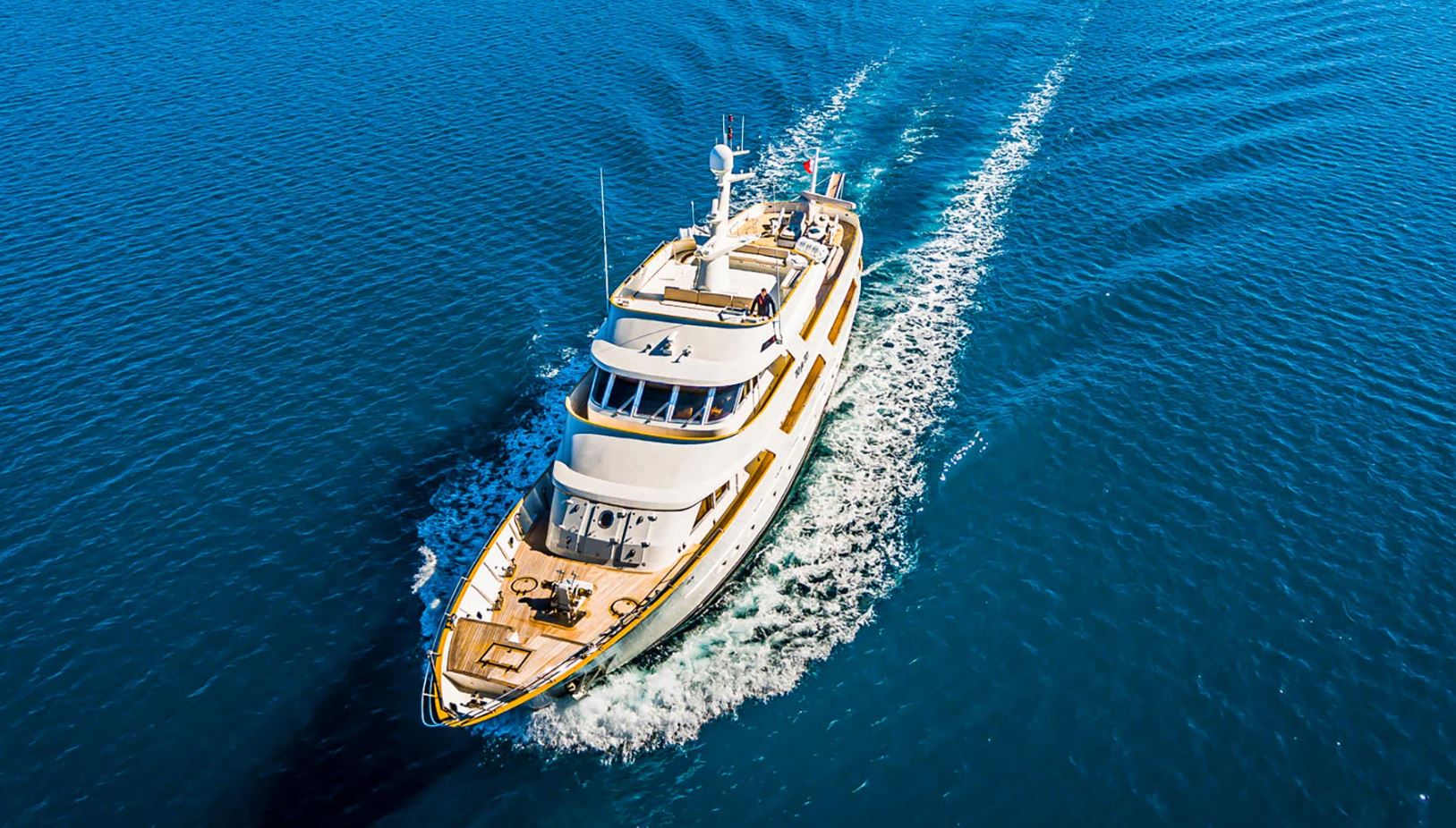 To Je To gliding gracefully through azure waters, showcasing its elegant profile and luxurious design.