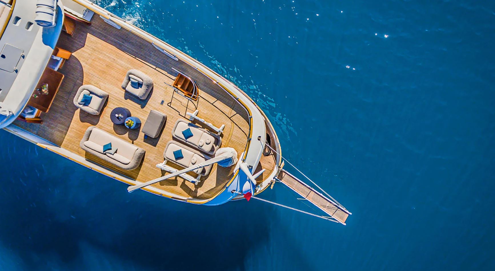 Aerial view of To Je To's spacious deck with luxurious seating and sun loungers.