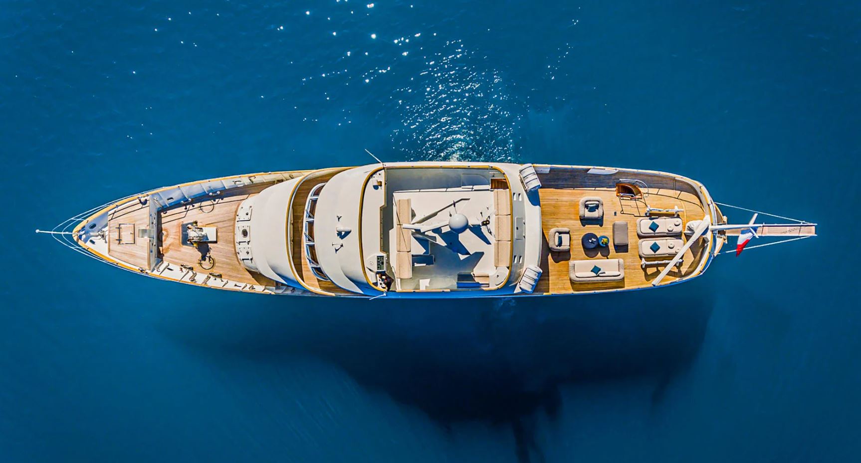 Aerial view of To Je To showcasing its sleek profile and luxurious deck layout.