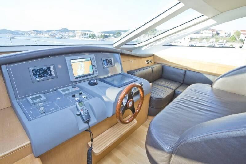 Sleek helm of the 70 2007 yacht featuring modern navigation systems and luxurious seating.