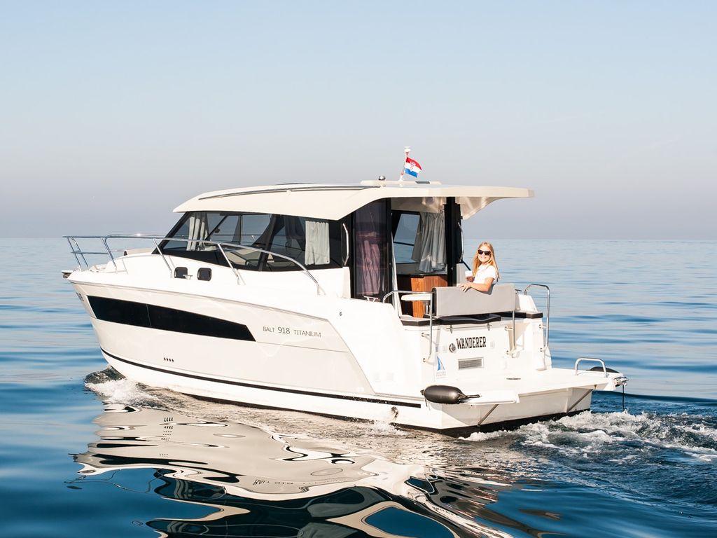 Wanderer glides effortlessly across calm waters, showcasing its sleek profile and elegant design.
