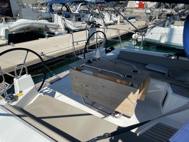 Spacious cockpit of Enjoy yacht featuring modern helm stations and comfortable seating.