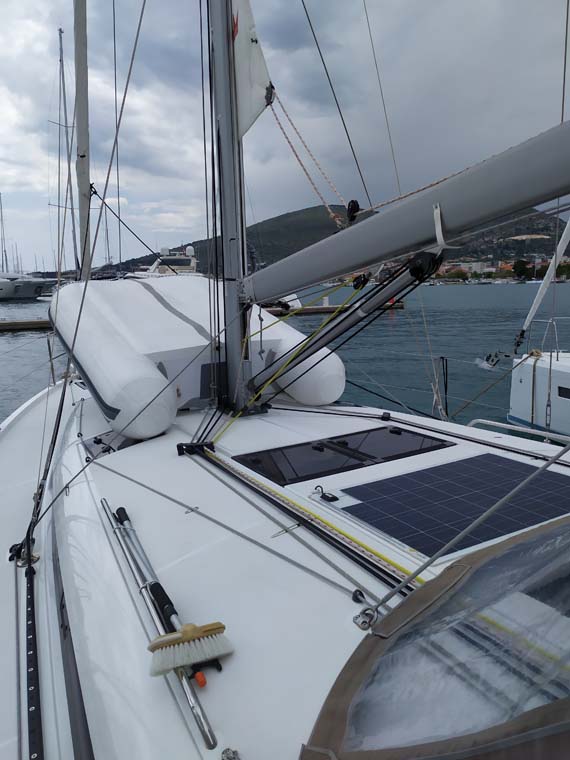 Sleek deck of Uccelli featuring solar panels, showcasing modern eco-friendly design.