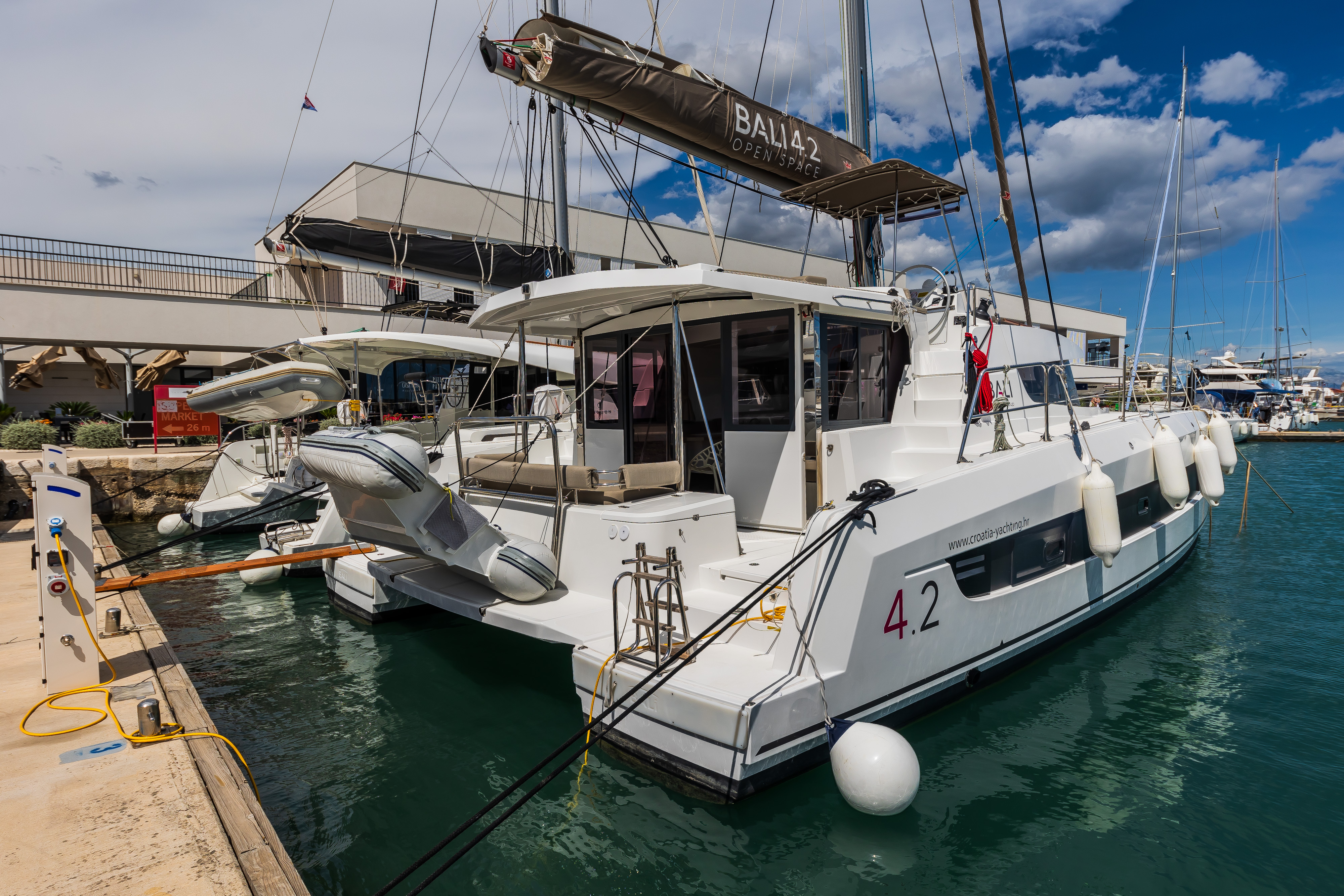 Sleek exterior of Liesbeth showcasing elegant lines and luxurious amenities at the marina.