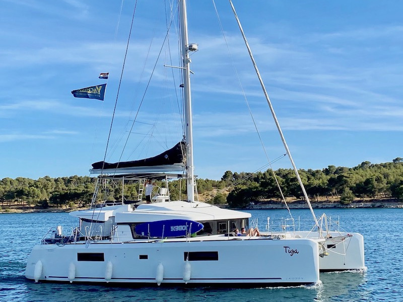 Elegant TIGA gliding through serene waters, showcasing its sleek hull and modern design.