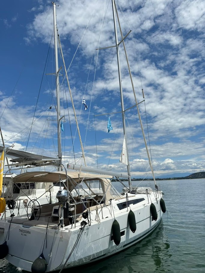 Theodora anchored in serene waters, showcasing its sleek profile and elegant design.