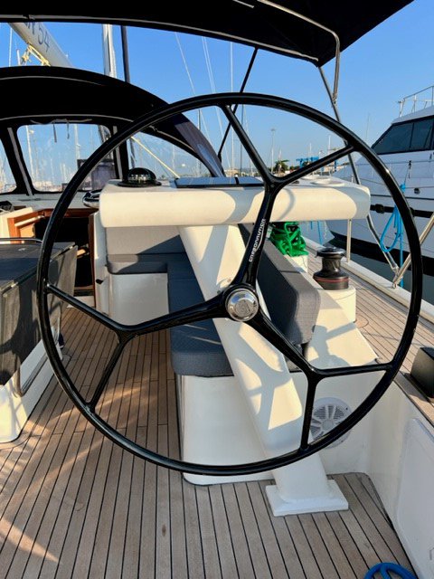 Sophisticated helm station of Sofia Blu featuring a sleek steering wheel and elegant finishes.