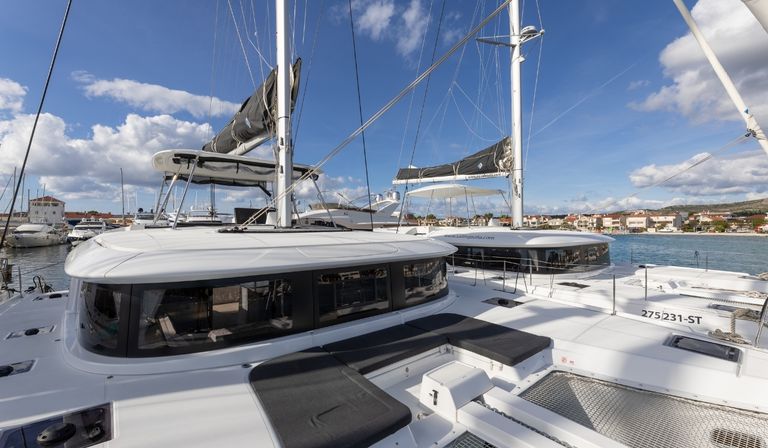 Sleek profile of Linda II's deck showcasing modern design and spacious lounging areas.