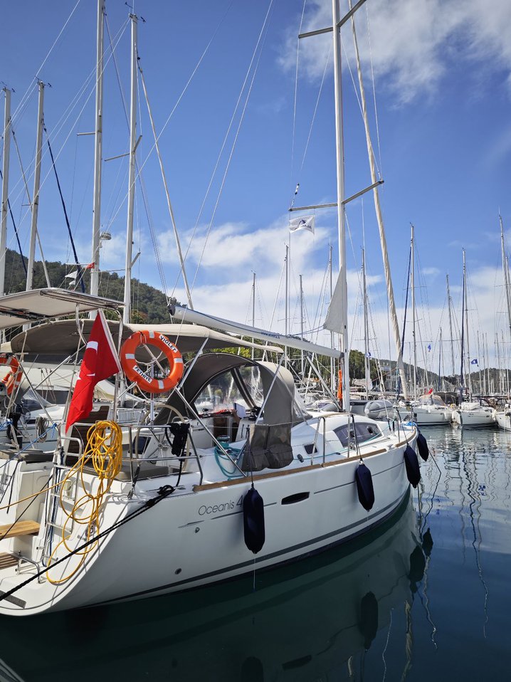 Violet anchored in a serene marina, showcasing its elegant lines and inviting atmosphere.