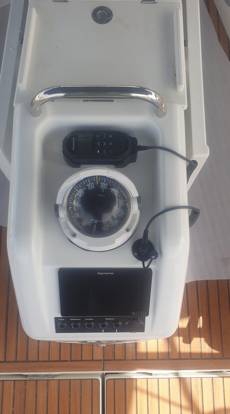 Sleek helm station of The Song Is You, featuring modern navigation equipment and controls.
