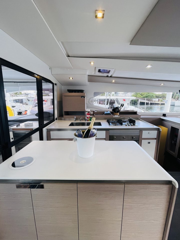 Sleek, modern kitchen aboard Hoylah featuring elegant materials and abundant natural light.