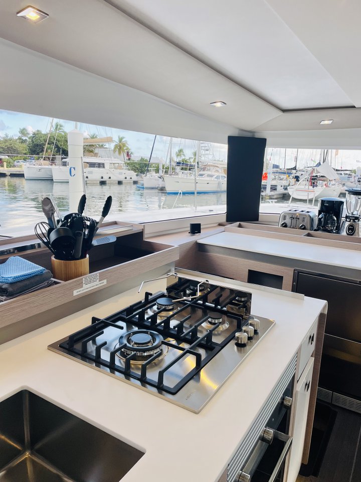 Sleek galley of Hoylah featuring modern appliances and serene marina views.