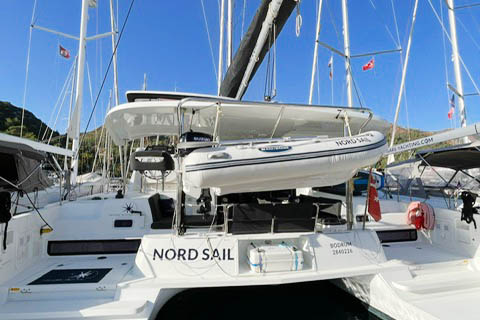 Sleek stern view of NORD with a tender and luxurious deck space.