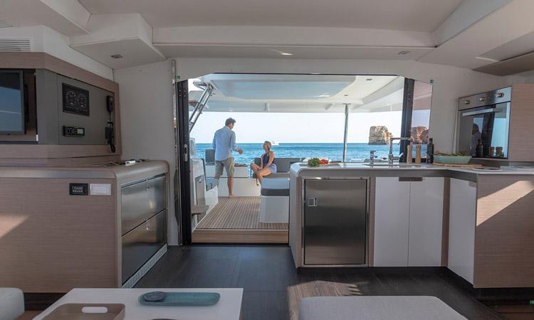 Elegant interior of Seeker, showcasing modern kitchen and seamless outdoor access.