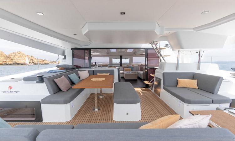 Luxurious interior of Seeker featuring elegant seating, natural light, and refined materials.