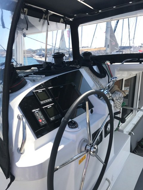 Sleek helm of the Tulip, featuring modern controls and panoramic views of the marina.