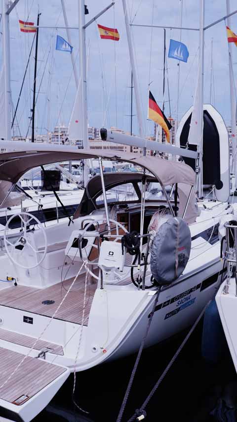 Elegant helm of Saona showcasing modern design and luxurious finishes in a marina setting.