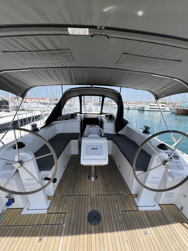 Spacious cockpit of Nela featuring dual steering wheels and comfortable seating for guests.