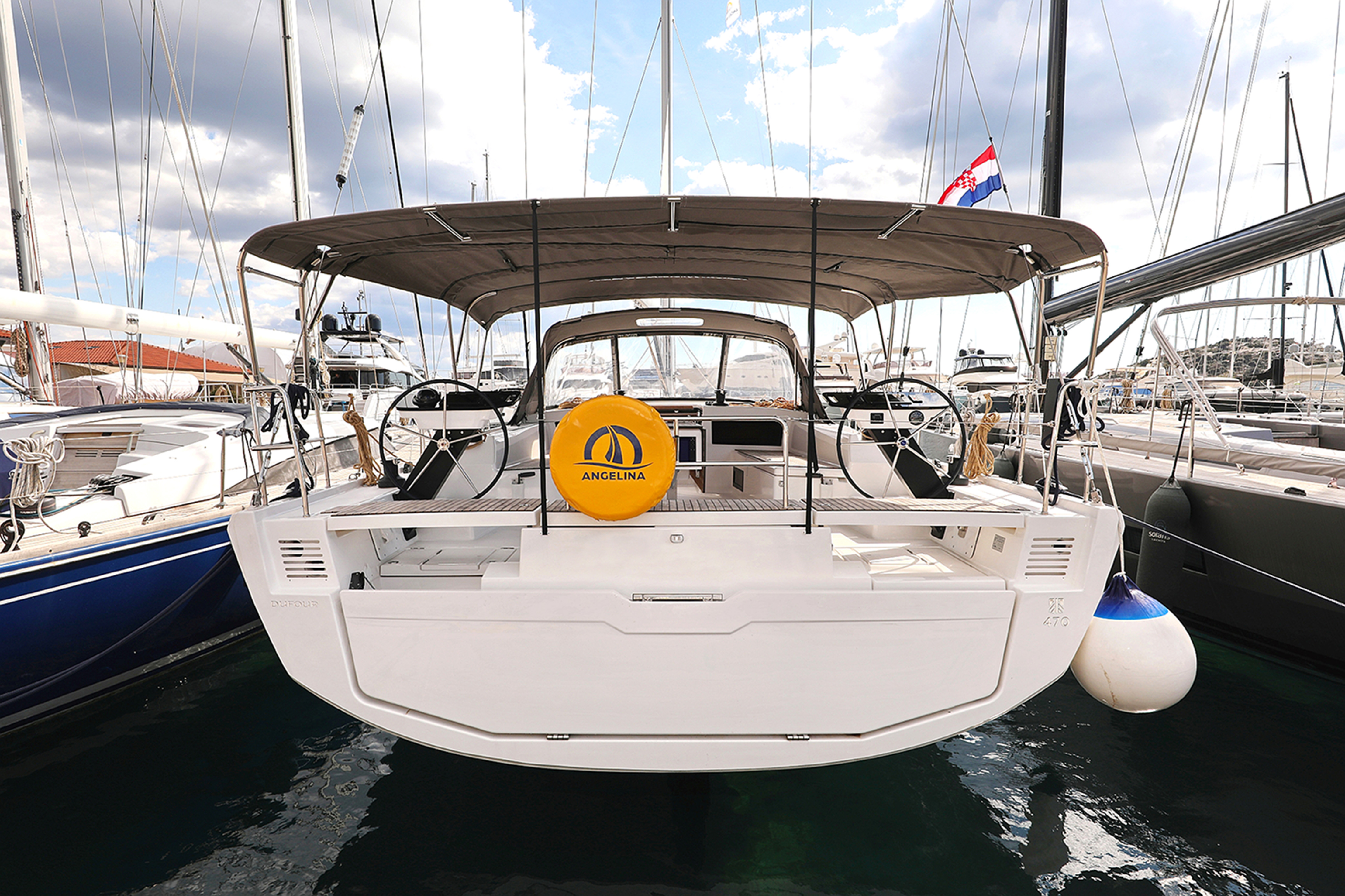 Sleek profile of Shore Thing showcasing its elegant stern and spacious cockpit area.