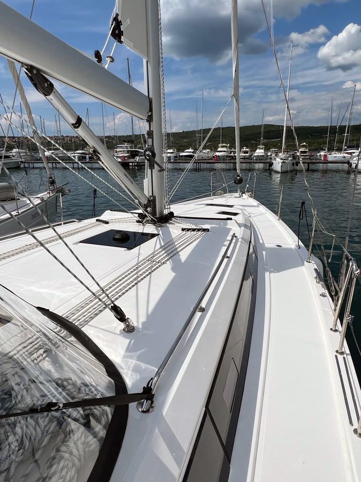 Sleek deck of the Gala yacht showcasing modern design and pristine marina surroundings.