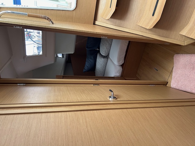 Elegant cabin interior of the Tomeu featuring warm wood finishes and natural light.