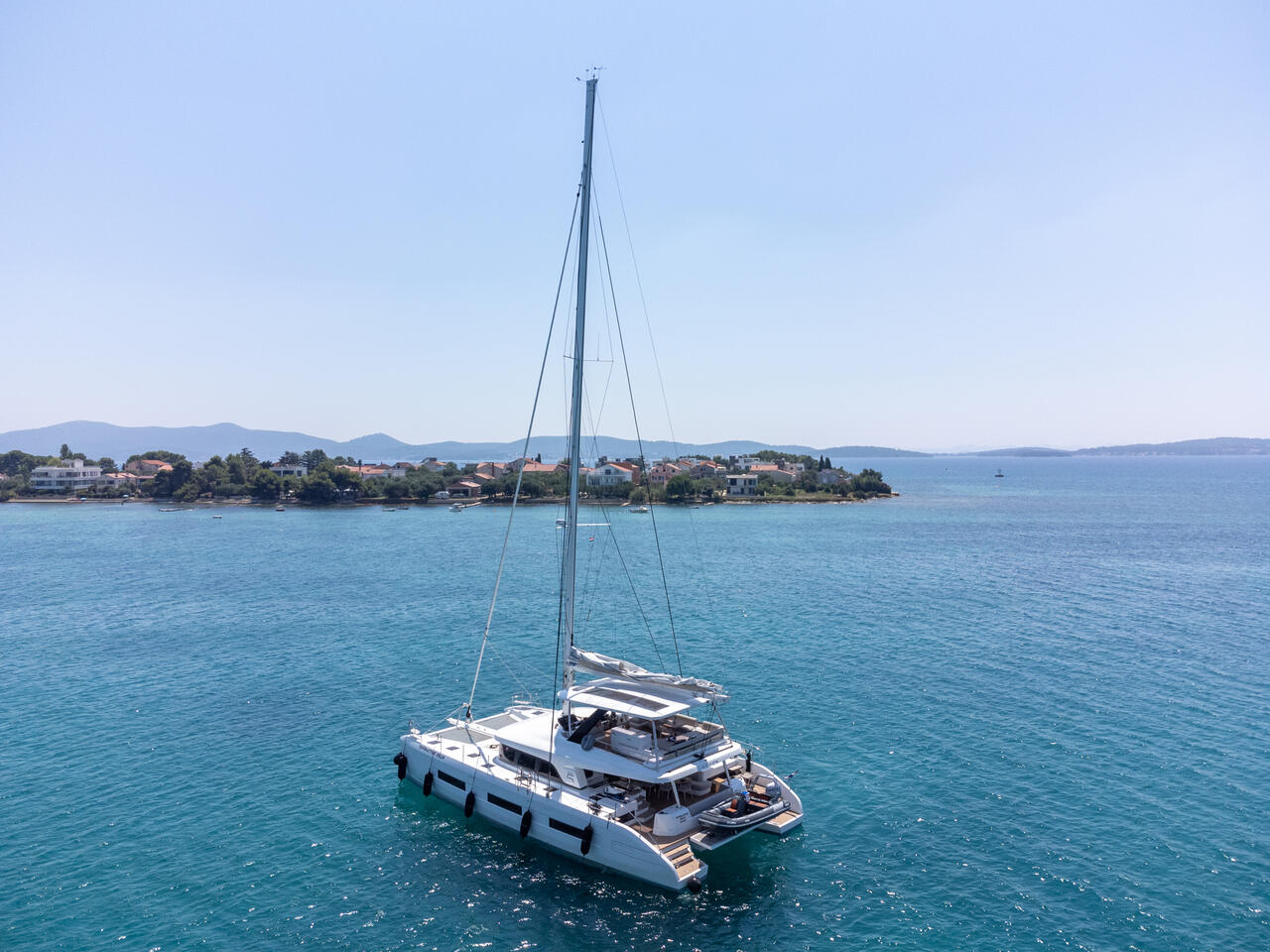 Seaductive Orca gracefully sailing in crystal-clear waters, showcasing its elegant profile and luxurious design.