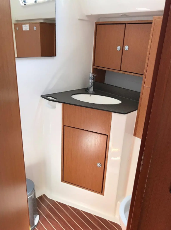 Luxurious bathroom in Juniper featuring elegant wood cabinetry and modern fixtures.