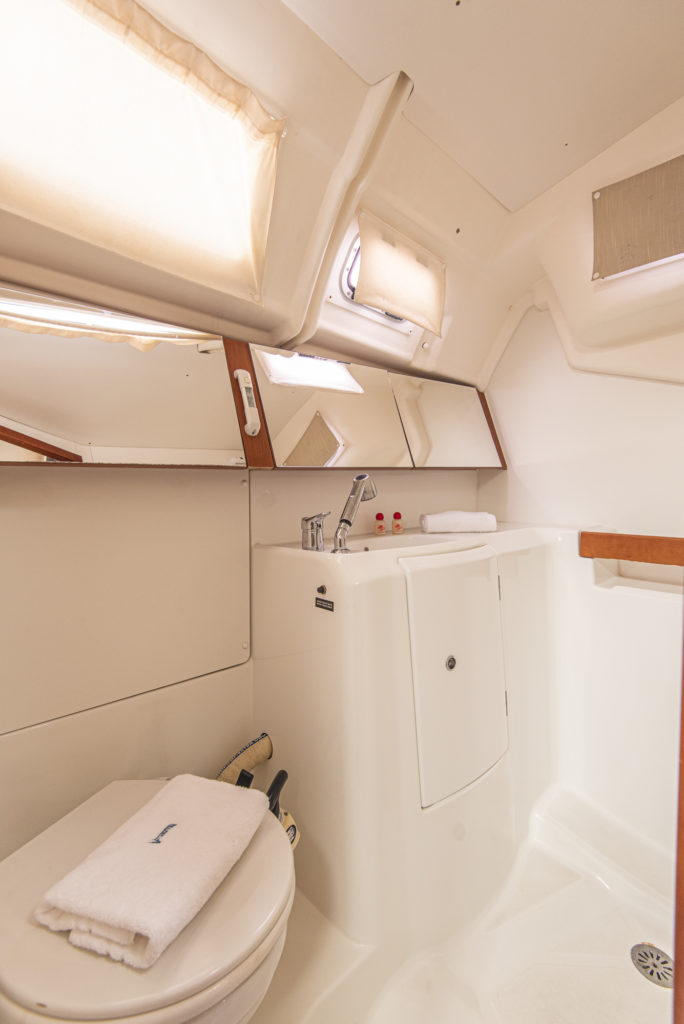 Bright and spacious interior of Rebecca's bathroom featuring elegant fixtures and ample storage.