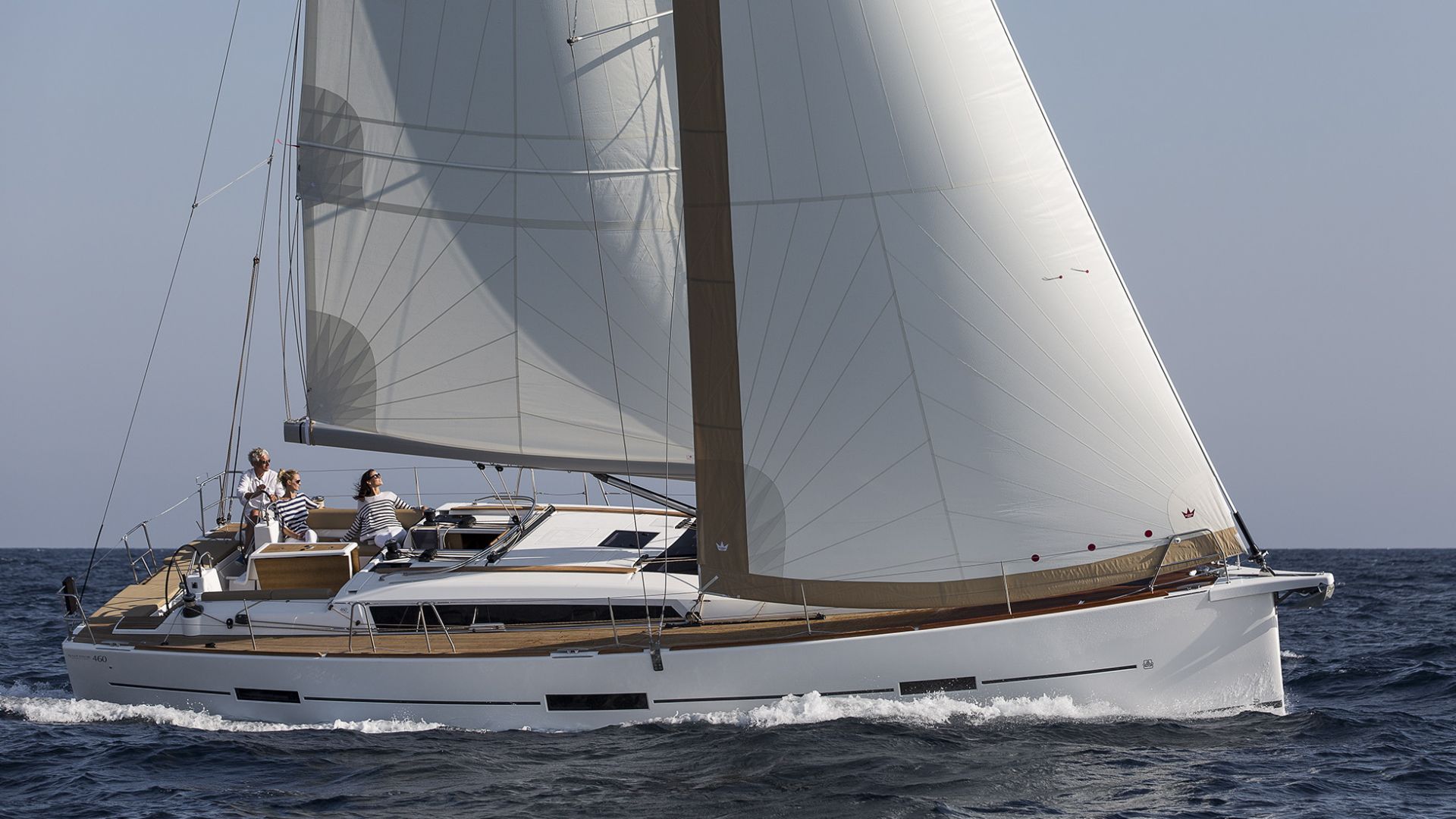 Sleek profile of Alegro sailing gracefully, showcasing its elegant hull and billowing sails.