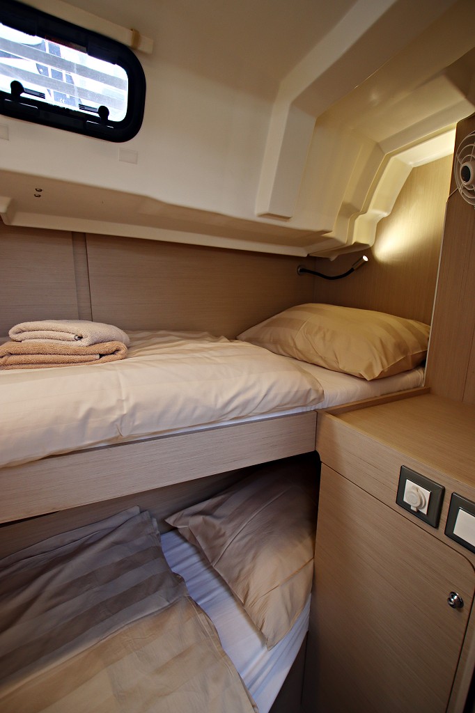 Luxurious cabin aboard Liberty featuring elegant materials, soft lighting, and refined layout.