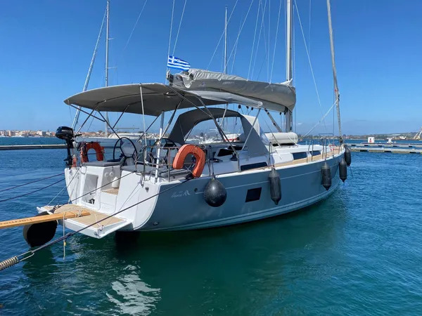 Sleek exterior of Zoe showcasing a modern hull design against a vibrant blue sea.