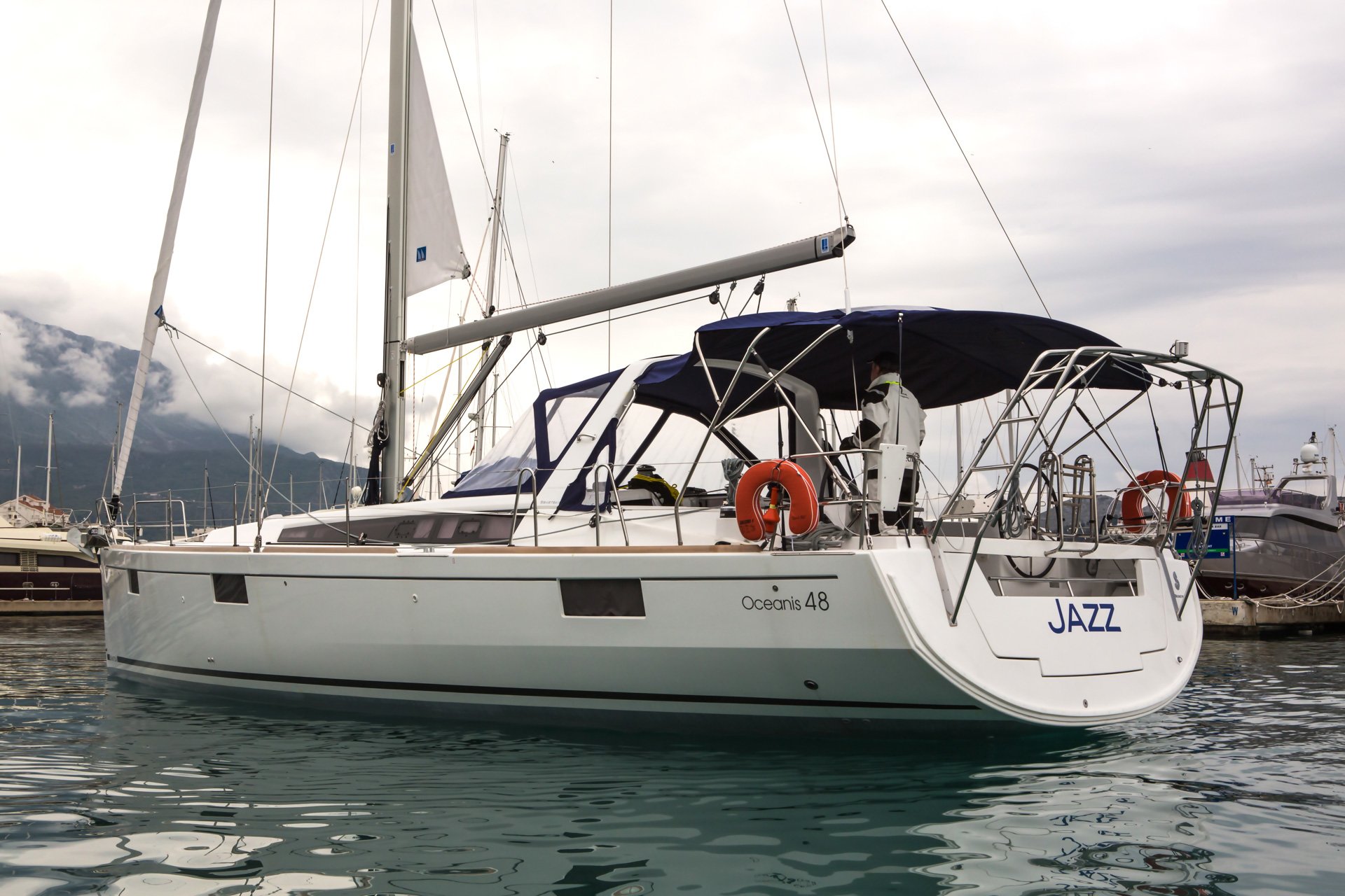 Sleek profile of the Jazz yacht gliding through tranquil waters, showcasing elegance and luxury.