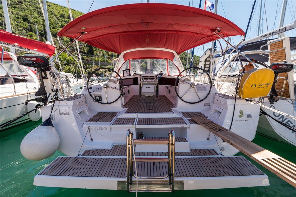 Spacious and elegant cockpit of Ultra Dubrovnik, featuring teak decking and stylish seating.