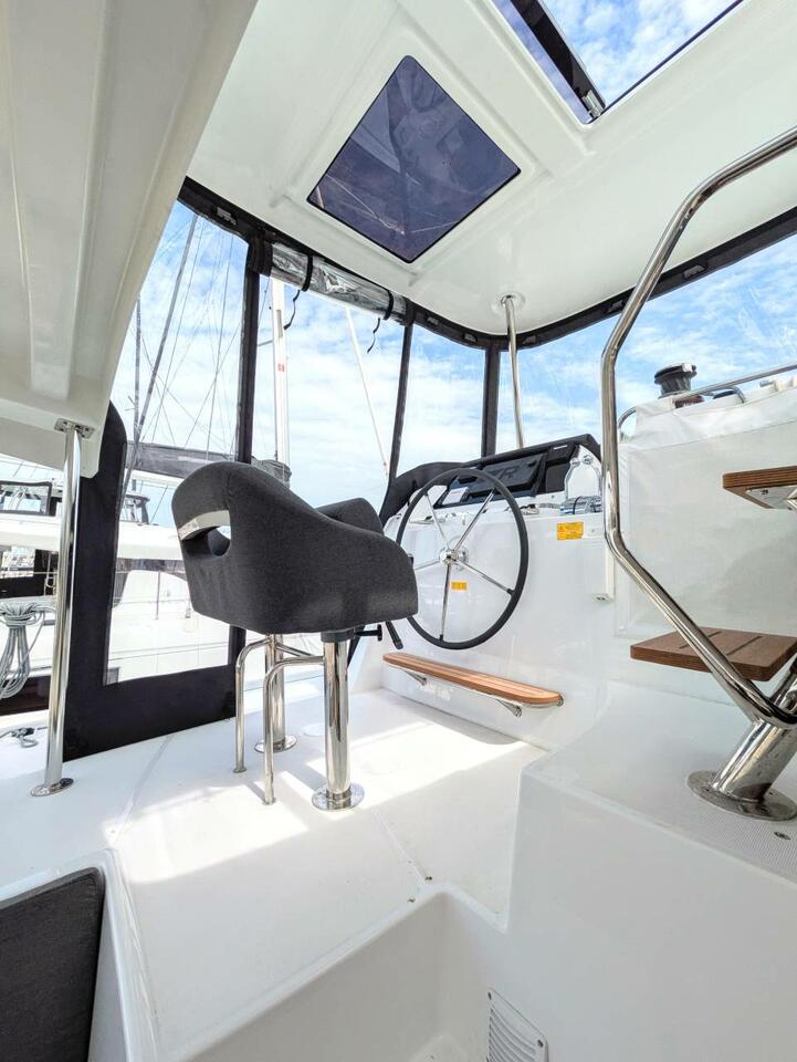 Sleek and modern helm of Zannannan, featuring advanced navigation equipment and comfortable seating.