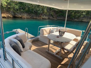 Luxurious outdoor seating area on Atil, featuring elegant furnishings and stunning water views.