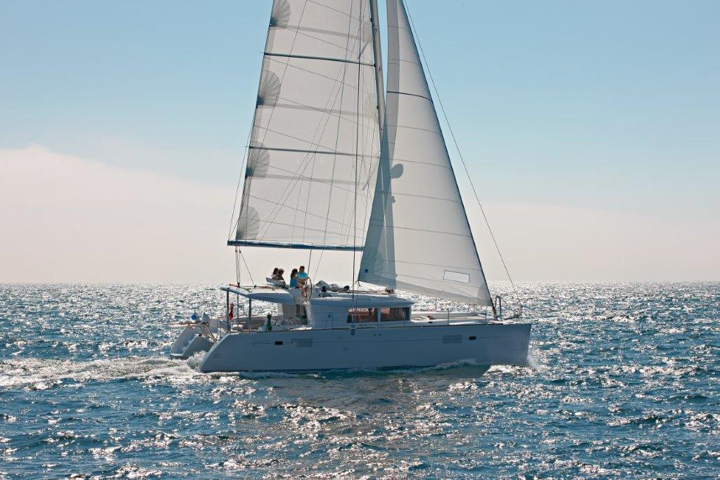 Luna gracefully sails through shimmering waters, showcasing its elegant hull and billowing sails.