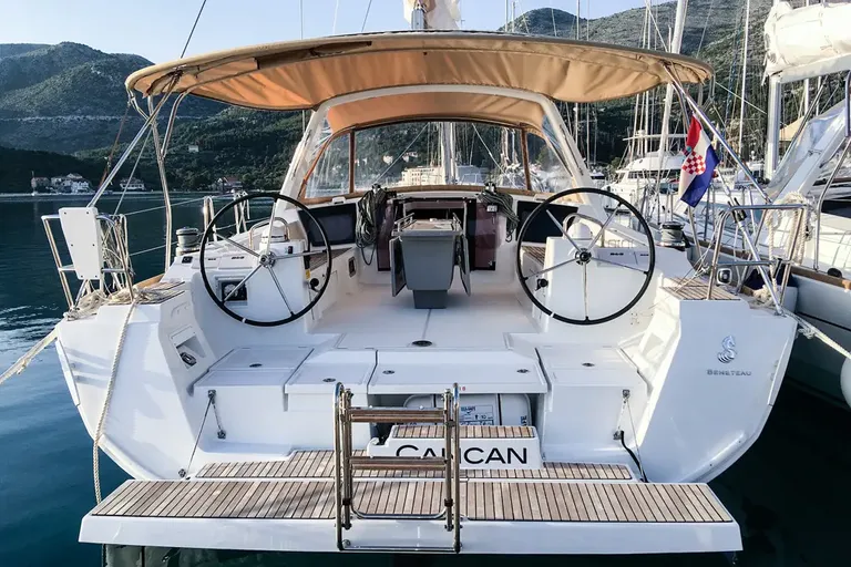 Sleek rear view of Cancan showcasing dual steering wheels and elegant outdoor seating.
