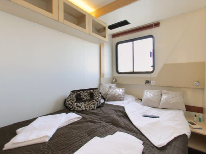 Luxurious cabin on Vision4 - Comfort Plus 5 featuring elegant materials and natural light.