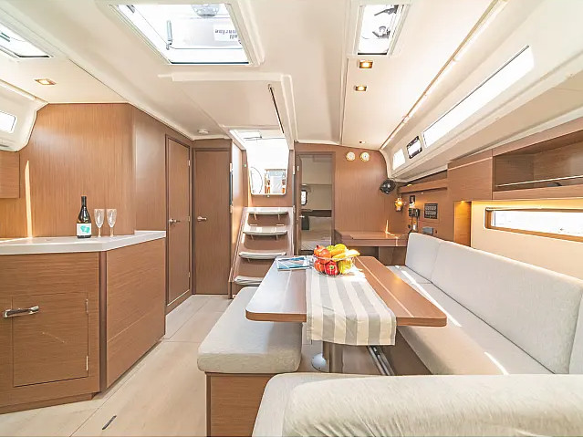 Elegant interior of RO22 featuring warm wood finishes, spacious dining area, and natural light.