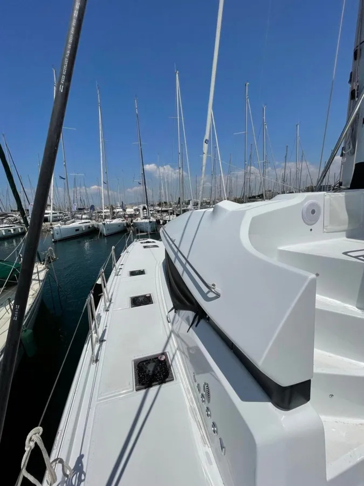 Sleek profile of Silhouette docked in a vibrant marina, showcasing its luxurious design.