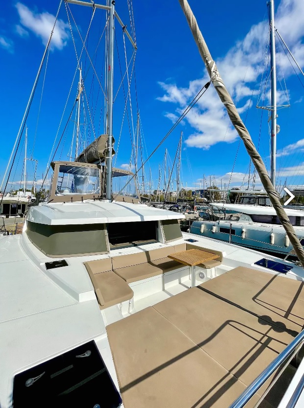 Spacious deck of Nereida featuring comfortable seating and stunning marina views.
